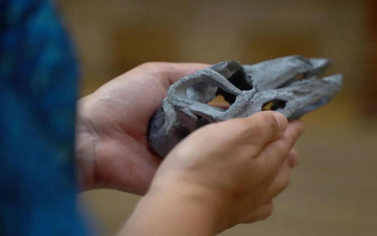 Bringing a New Dinosaur to Life with The Natural History Museum 2 lady holding 3d printed stegosaurus skull